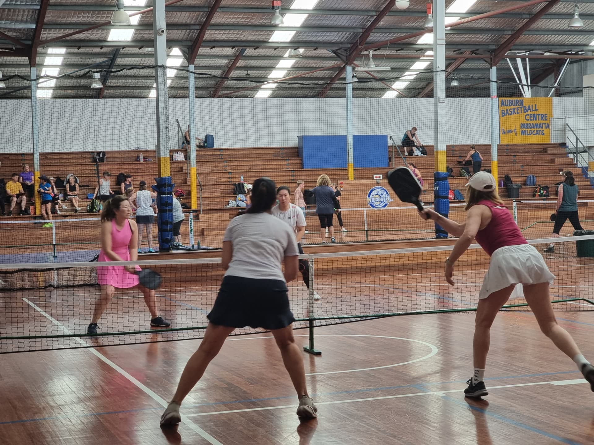 Two doubles pairs competing during a club session